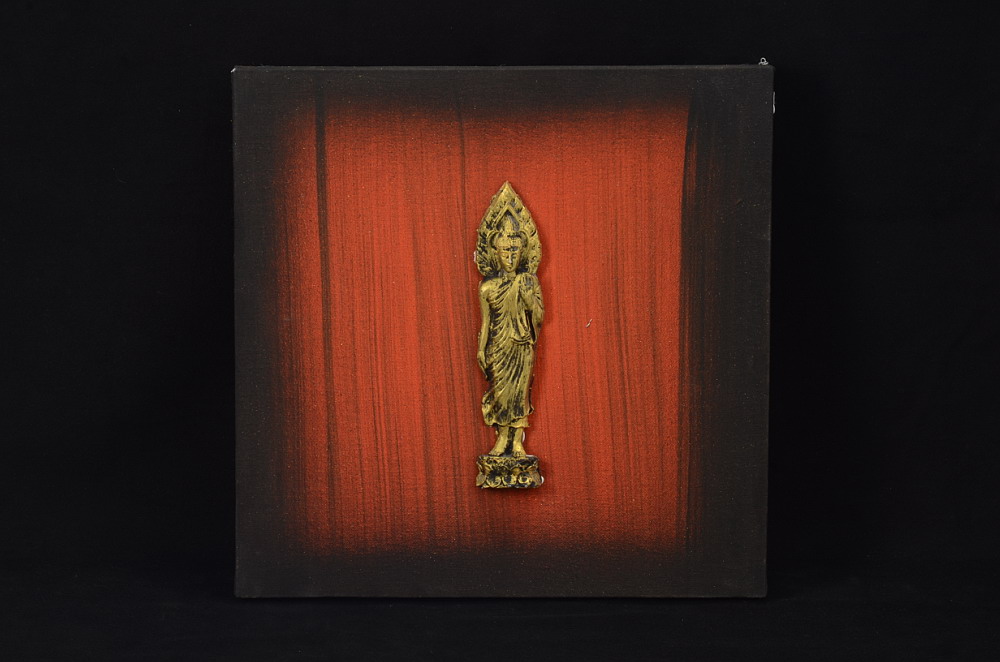 Obraz na plátně s motivem stojícího Buddhy, oranžovo-černý
