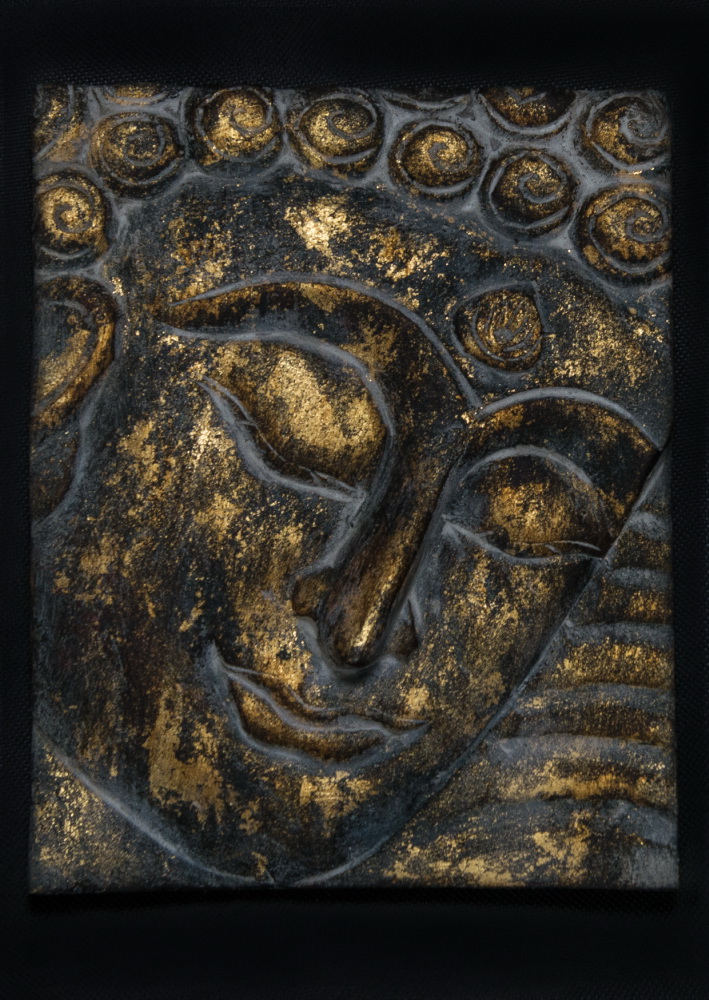 Plastický Buddha a jeho tvář